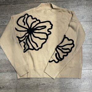 Beige Sweater with Black Floral Design